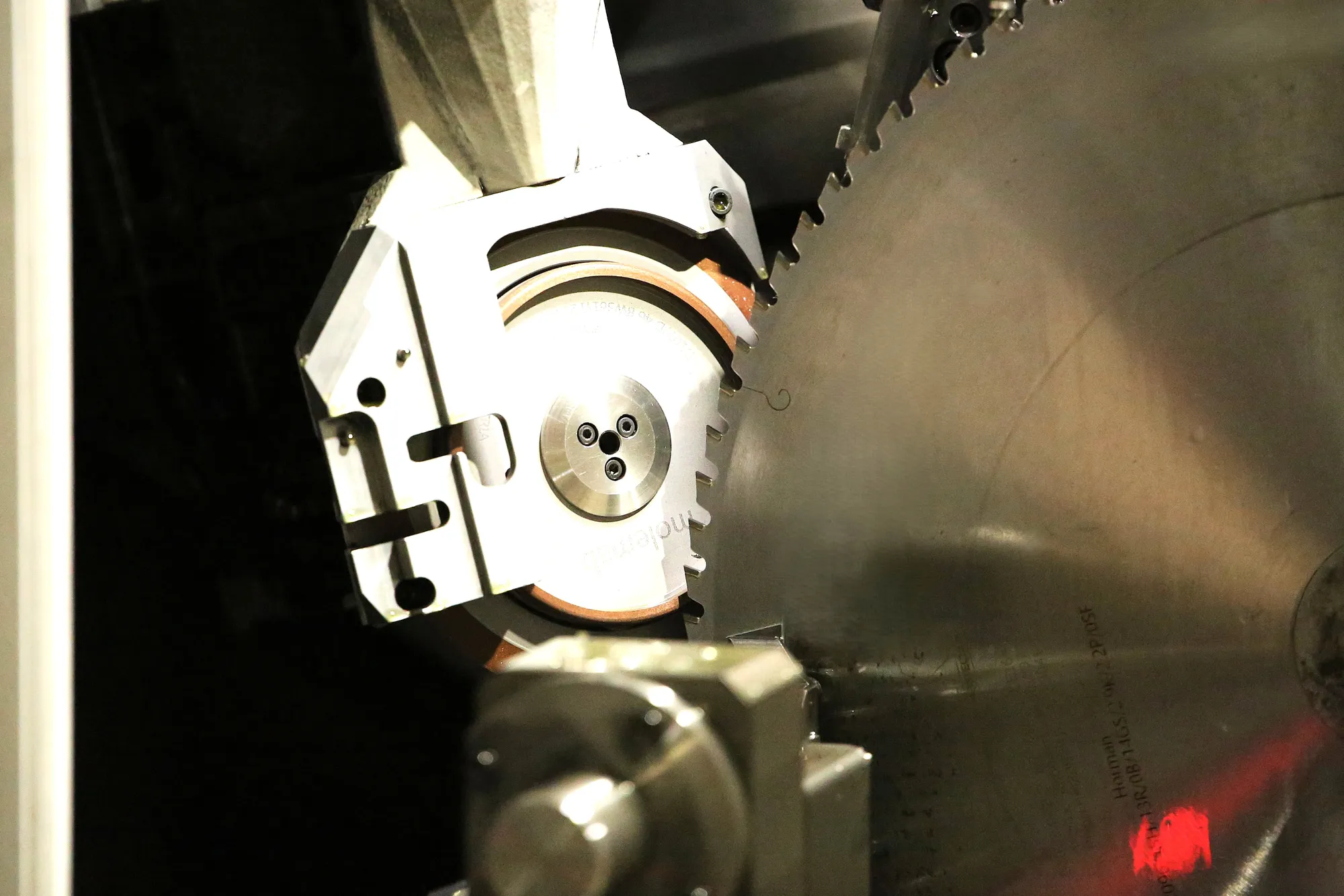 Freud Certified technician grinding a blade on CHP equipment at Byler Industrial Tool